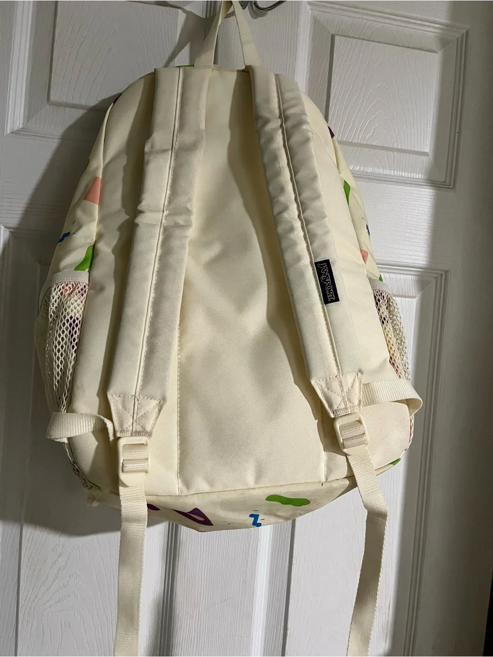 Jansport Cream Backpack with Multicolor Geometric Print